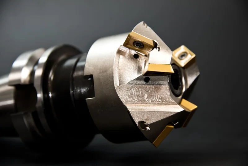 A metal milling cutter with gold inserts