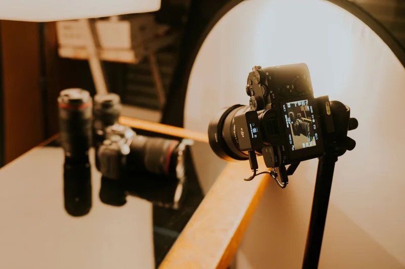 A camera on a stand in soft studio light